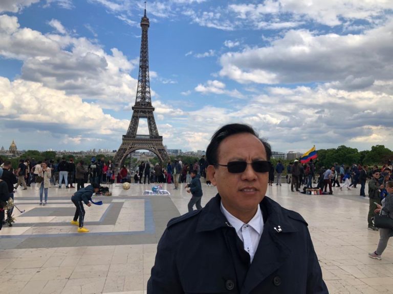 Chin Jin in front of Eiffel Tower, France